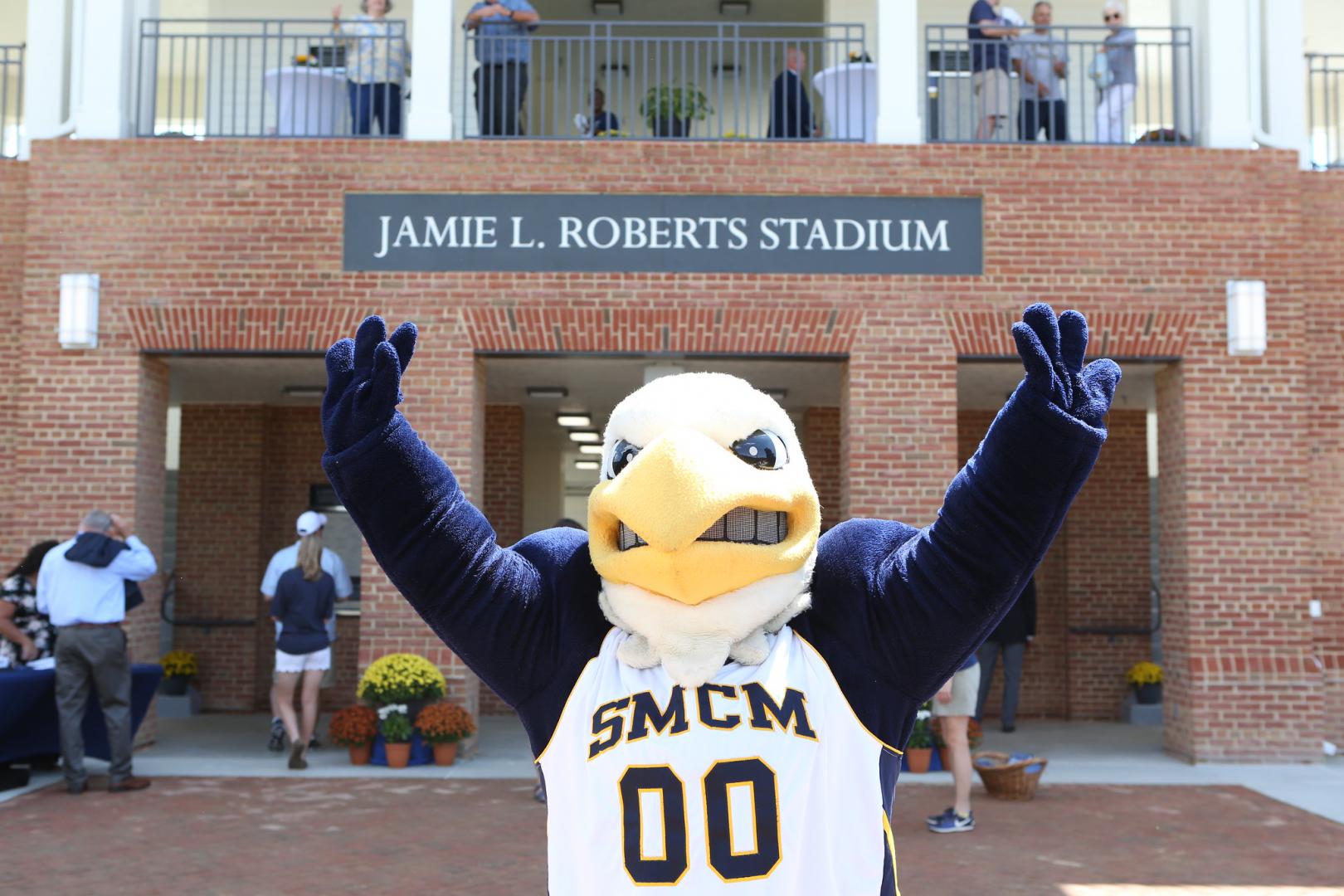 Solomon the Seahawk standing in front of the Jamie L. Roberts Stadium