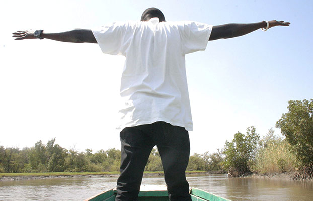 Student on a boat in The Gambia