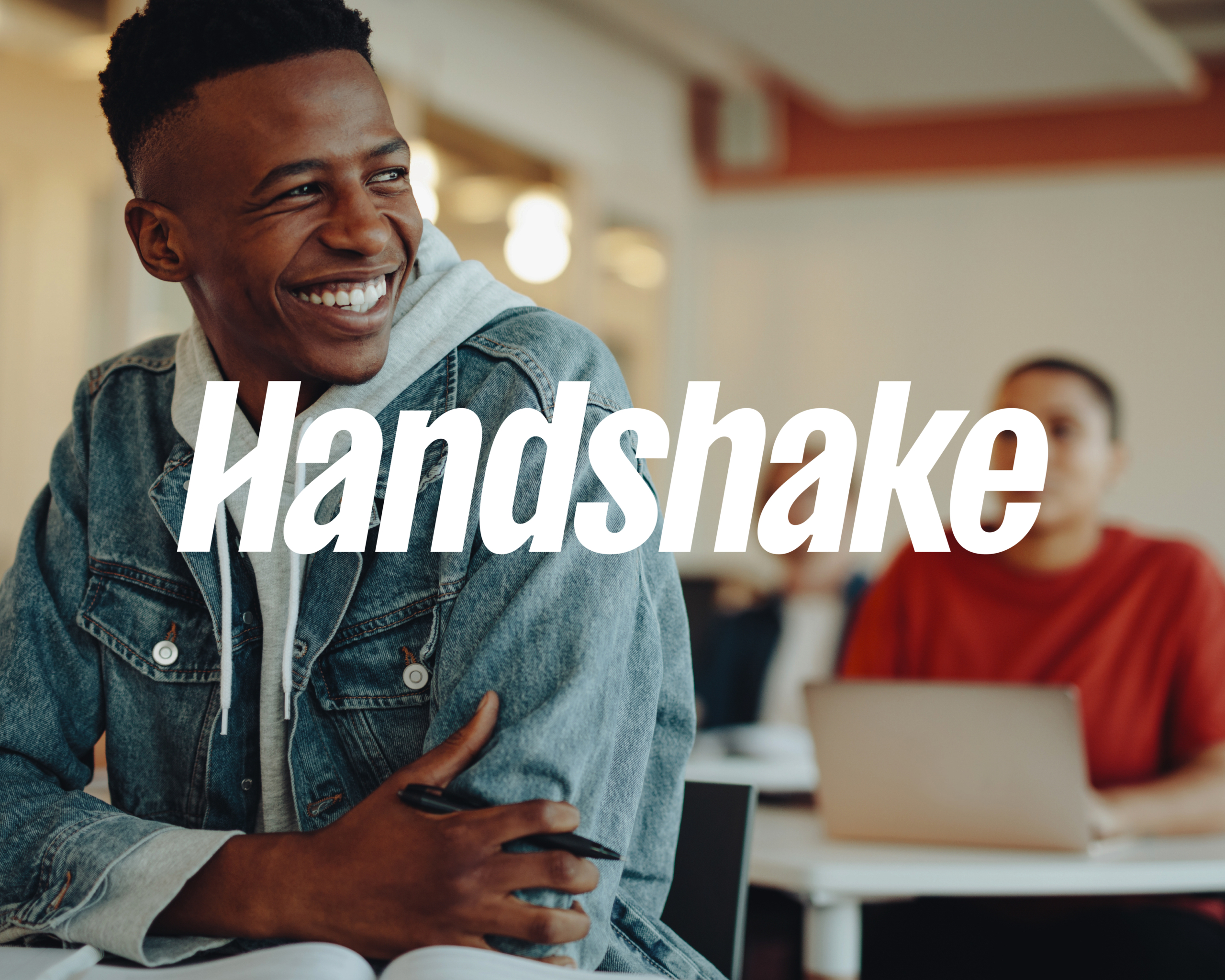 Photo of students in a classroom, with the Handshake logo in the foreground