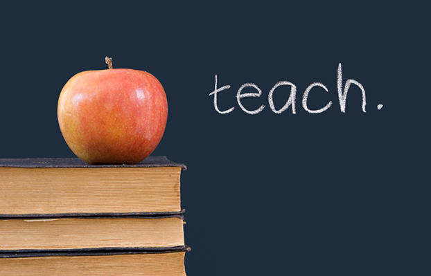 "teach" written on blackboard, apple, books