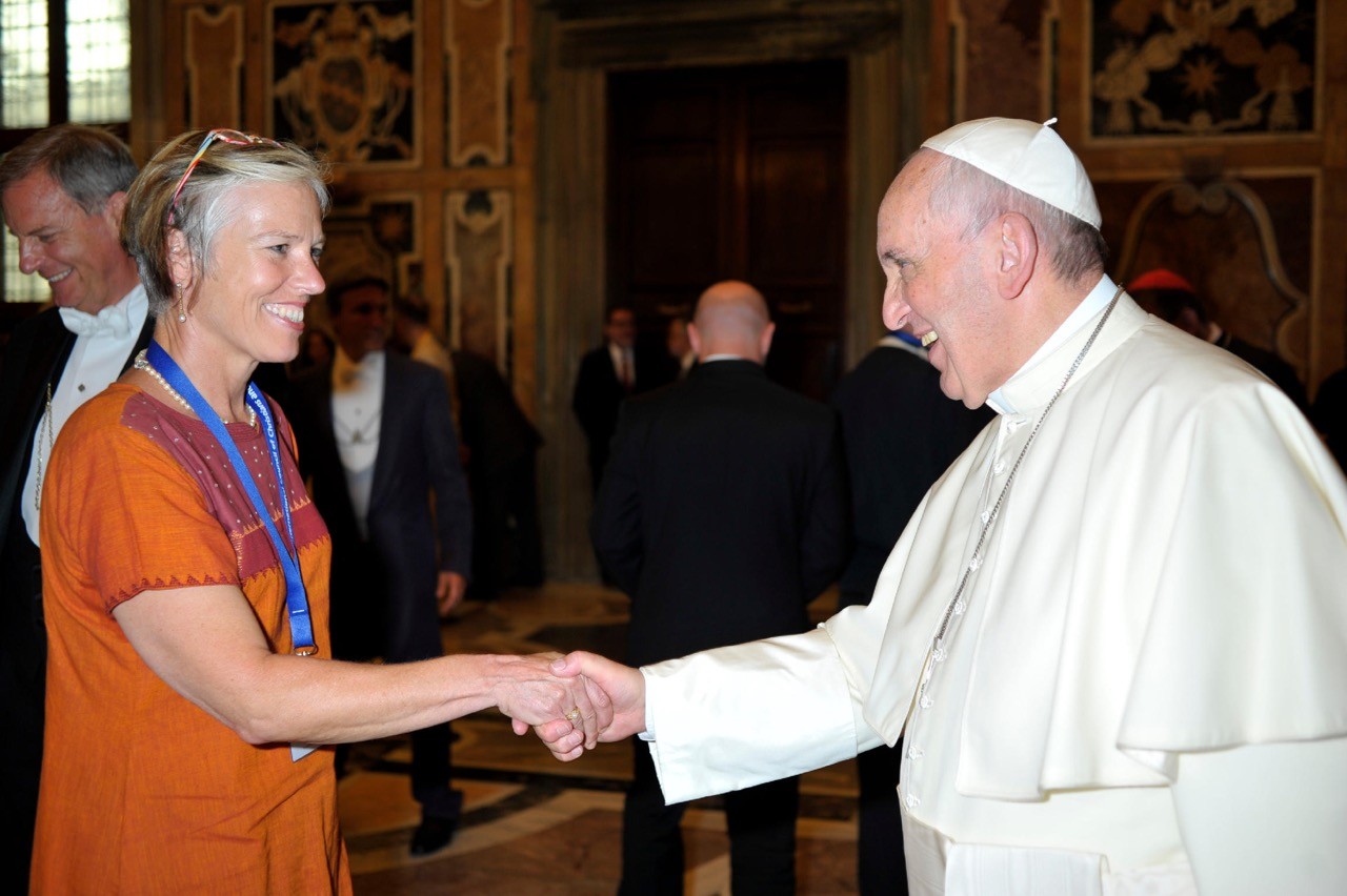 A smcm instructor shaking hands with the Pope