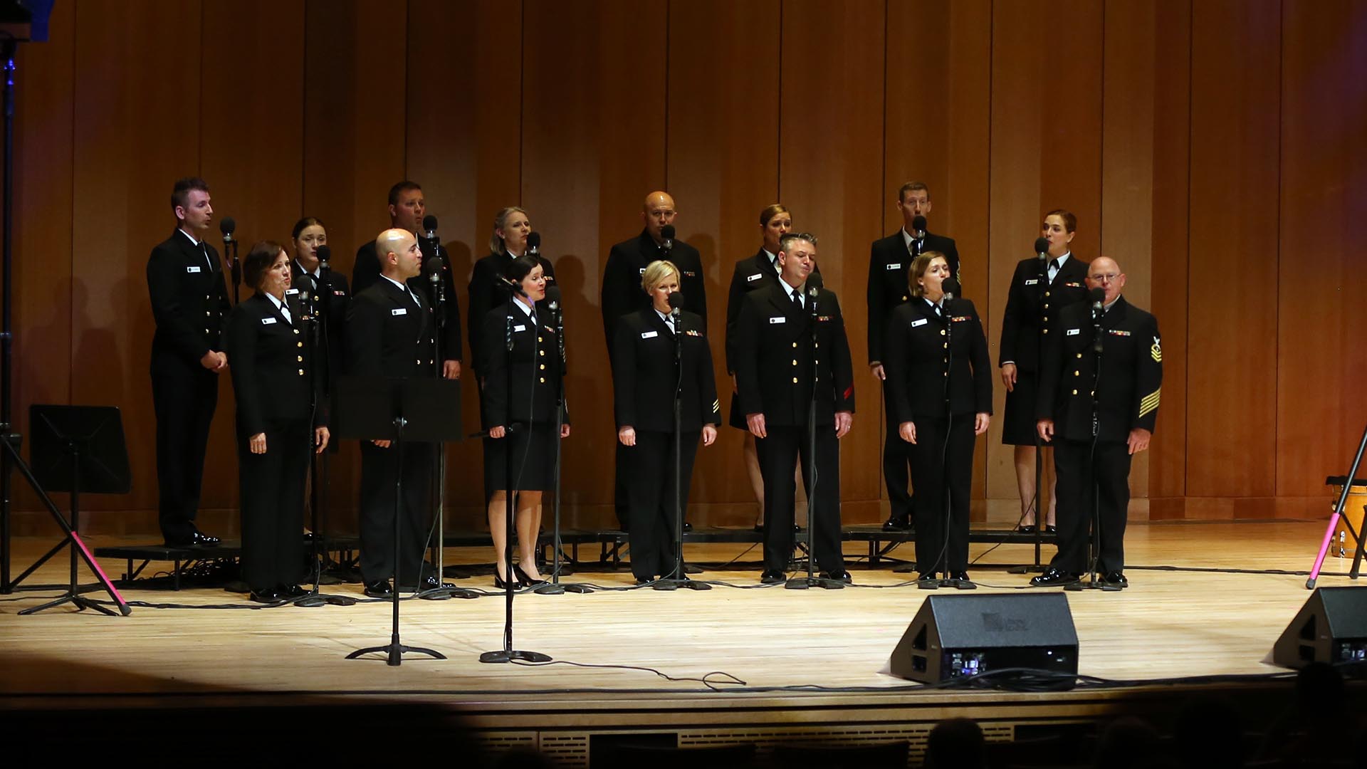 Sea Chanters performing on stage at the Nancy R. and Norton T. Dodge auditorium.